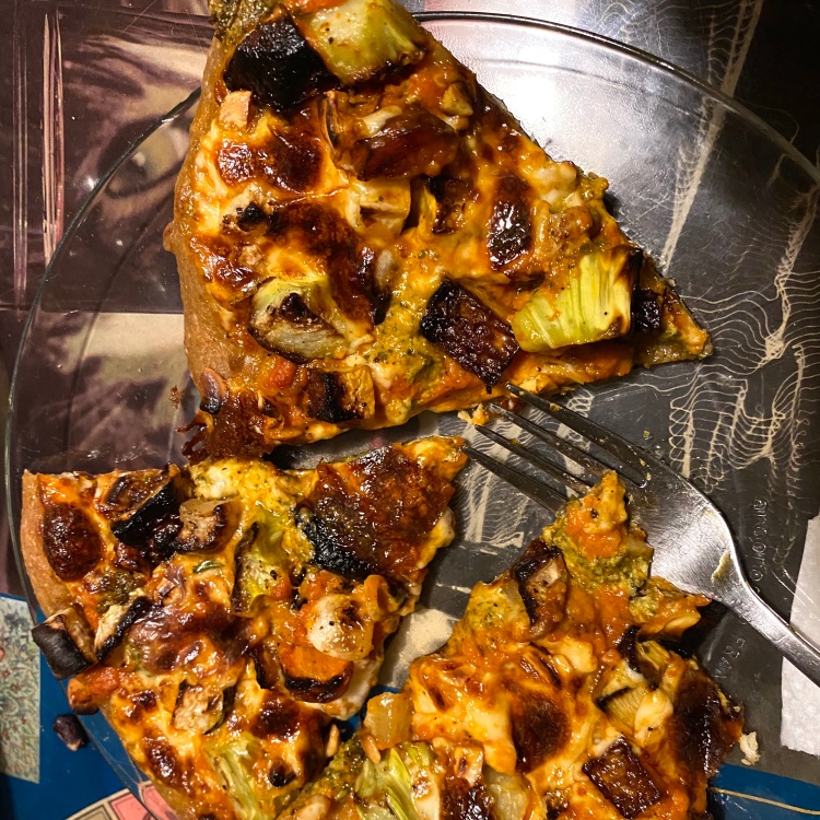 three pizza slices on a plate with toppings listed in caption plus lots of cheese