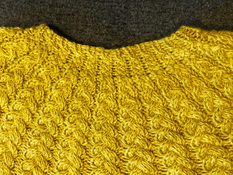 closeup of back neck short rows on sweater laying flat