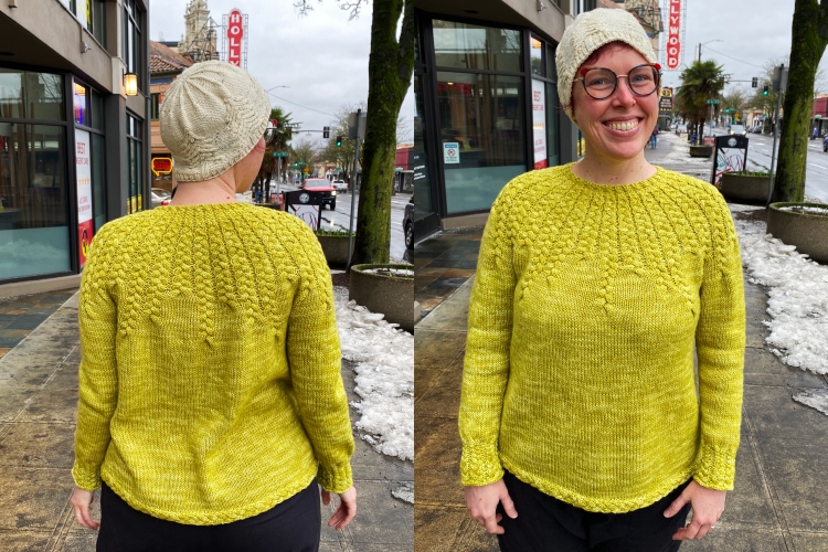 two photos of Lee wearing the sweater, showing the back and the front