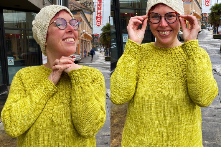 two photos of Lee wearing the sweater and holding arms up to show off the sleeves